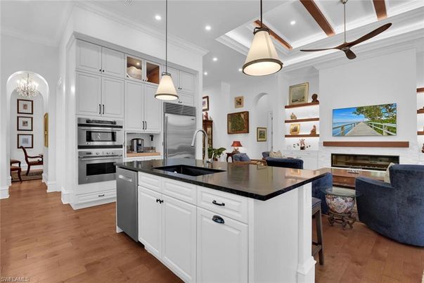 Fireplace, Interior, Kitchen, Pendant Lights, Recessed Lighting, Stainless Steel Appliances, Wood Texture Flooring
