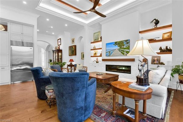 Dining room, Fireplace, Interior, Living room, Recessed Lighting, Wood Texture Flooring