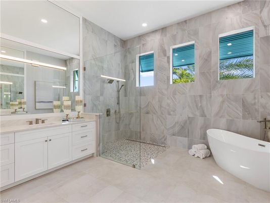 Bathroom, Dual Sink Vanities, Free Standing Baths, Glass Shower, Interior, Marble Walls, Recessed Lighting