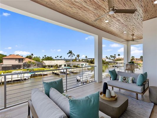 Exterior, Interior, Living room, Recessed Lighting, Water, Wooden Ceilings, Wood Texture Flooring