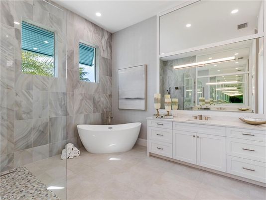 Bathroom, Dual Sink Vanities, Free Standing Baths, Glass Shower, Interior, Marble Walls, Recessed Lighting