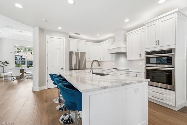 Dining room, Interior, Kitchen, Pendant Lights, Recessed Lighting, Stainless Steel Appliances, Wood Texture Flooring