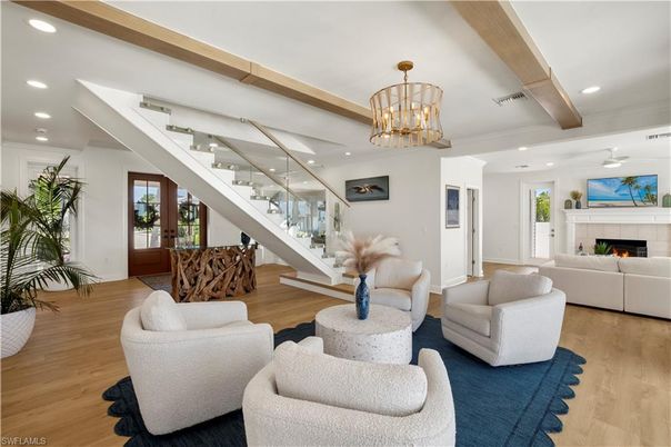 Chandelier, Fireplace, Interior, Living room, Recessed Lighting, Wood Texture Flooring