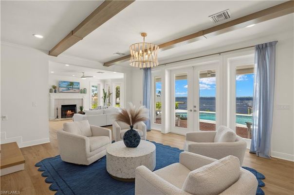 Chandelier, Fireplace, Interior, Living room, Recessed Lighting, Water, Wooden Beams, Wood Texture Flooring