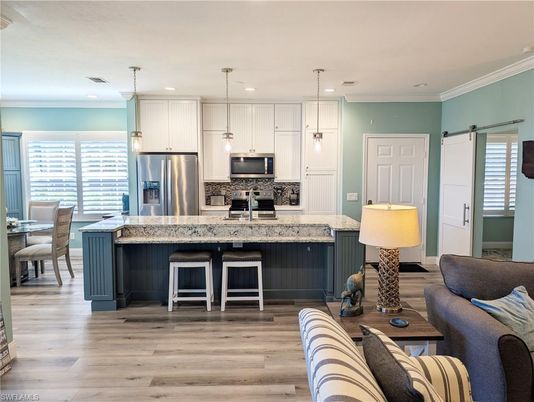 Dining room, Interior, Kitchen, Pendant Lights, Recessed Lighting, Stainless Steel Appliances, Wood Texture Flooring