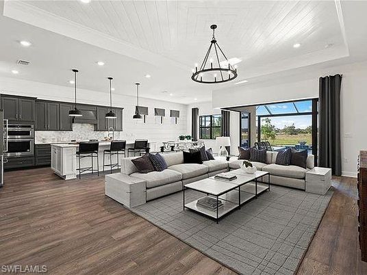 Chandelier, Dining room, Interior, Kitchen, Living room, Pendant Lights, Recessed Lighting, Stainless Steel Appliances, Wood Texture Flooring