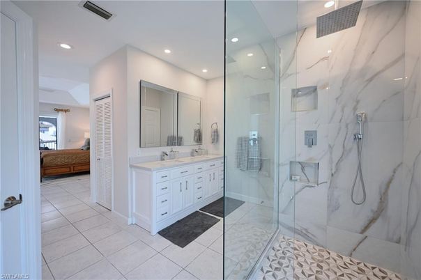 Bathroom, Dual Sink Vanities, Glass Shower, Interior, Marble Walls, Recessed Lighting