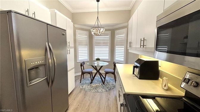 Chandelier, Dining room, Interior, Kitchen, Pendant Lights, Stainless Steel Appliances, Wood Texture Flooring