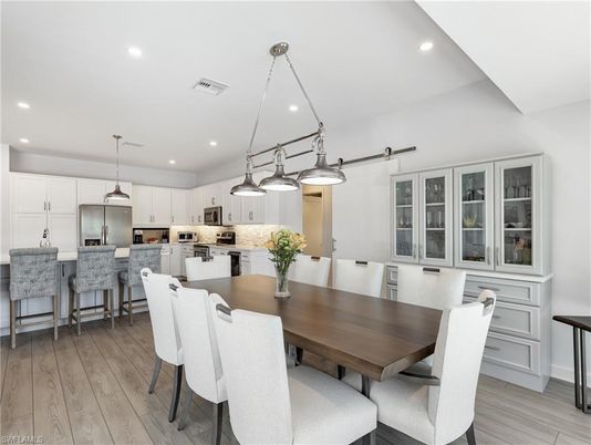 Dining room, Interior, Kitchen, Pendant Lights, Recessed Lighting, Stainless Steel Appliances, Wood Texture Flooring