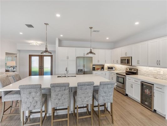 Interior, Kitchen, Pendant Lights, Recessed Lighting, Stainless Steel Appliances, Wood Texture Flooring