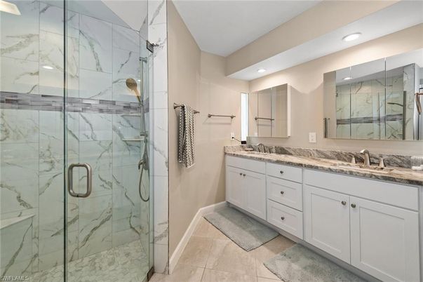 Bathroom, Dual Sink Vanities, Glass Shower, Interior, Marble Walls, Recessed Lighting