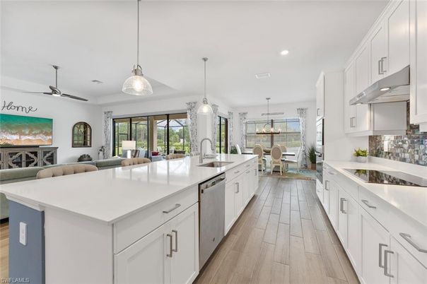 Dining room, Interior, Kitchen, Living room, Pendant Lights, Recessed Lighting, Stainless Steel Appliances, Wood Texture Flooring
