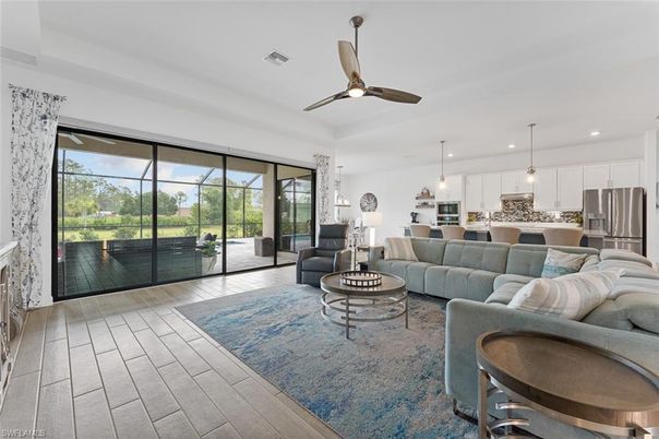 Fireplace, Interior, Kitchen, Living room, Pendant Lights, Recessed Lighting, Stainless Steel Appliances, Wood Texture Flooring