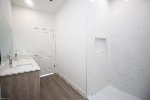 Bathroom, Interior, Marble Walls, Recessed Lighting, Wood Texture Flooring
