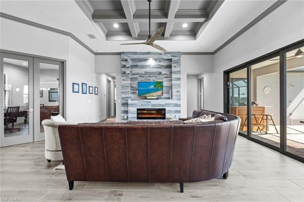 Fireplace, Interior, Living room, Recessed Lighting, Stone Walls, Wood Texture Flooring