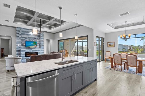 Chandelier, Dining room, Fireplace, Interior, Kitchen, Living room, Pendant Lights, Recessed Lighting, Stone Walls, Wood Texture Flooring