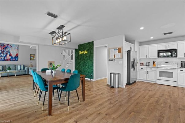 Dining room, Interior, Kitchen, Pendant Lights, Recessed Lighting, Stainless Steel Appliances, Wood Texture Flooring