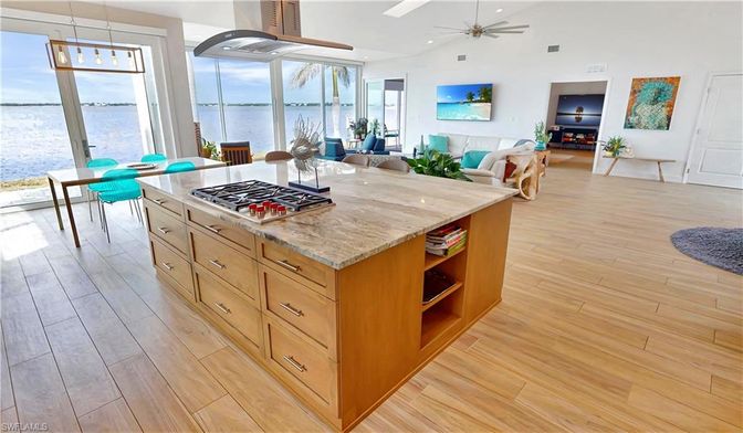 Dining room, Interior, Kitchen, Living room, Recessed Lighting, Water, Wood Texture Flooring