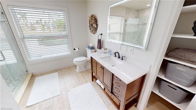 Bathroom, Dual Sink Vanities, Glass Shower, Interior, Recessed Lighting, Wood Texture Flooring