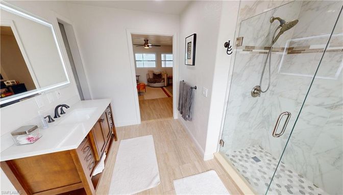 Bathroom, Glass Shower, Interior, Marble Walls, Wood Texture Flooring