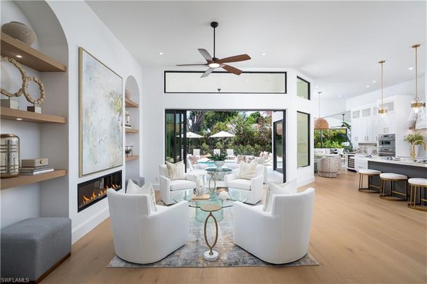 Fireplace, Interior, Kitchen, Living room, Pendant Lights, Recessed Lighting, Stainless Steel Appliances, Wood Texture Flooring