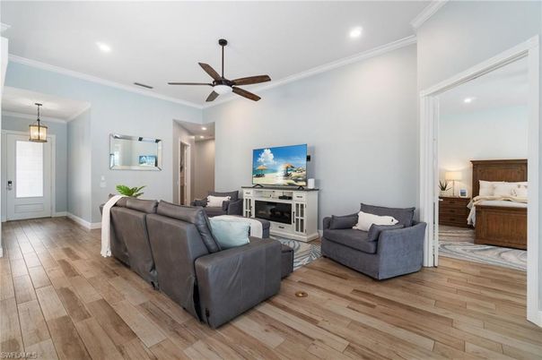 Bedroom, Fireplace, Interior, Living room, Pendant Lights, Recessed Lighting, Wood Texture Flooring