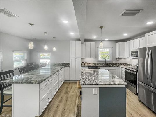 Interior, Kitchen, Pendant Lights, Recessed Lighting, Stainless Steel Appliances, Wood Texture Flooring