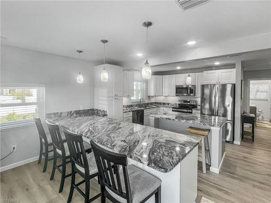 Interior, Kitchen, Pendant Lights, Recessed Lighting, Stainless Steel Appliances, Wood Texture Flooring