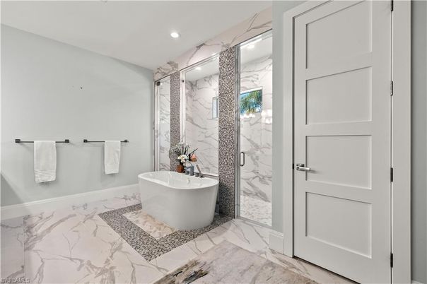 Bathroom, Free Standing Baths, Glass Shower, Interior, Marble, Marble Walls, Recessed Lighting