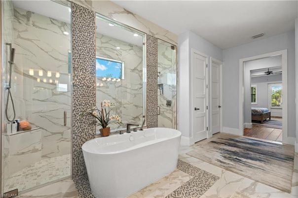 Bathroom, Free Standing Baths, Glass Shower, Interior, Marble, Marble Walls, Recessed Lighting, Wood Texture Flooring