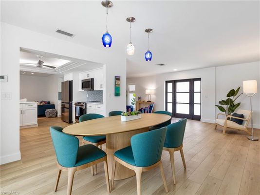 Dining room, Interior, Kitchen, Pendant Lights, Recessed Lighting, Stainless Steel Appliances, Wood Texture Flooring