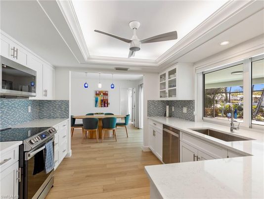 Dining room, Interior, Kitchen, Pendant Lights, Recessed Lighting, Stainless Steel Appliances, Wood Texture Flooring