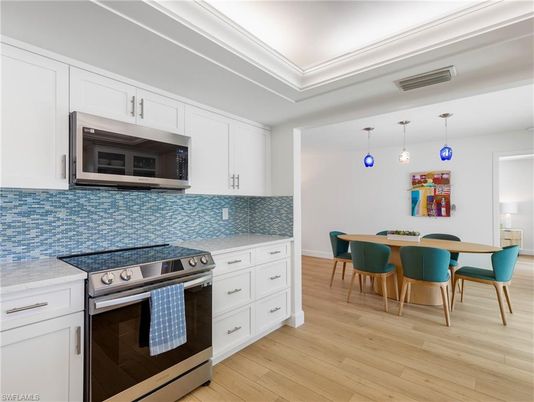 Dining room, Interior, Kitchen, Pendant Lights, Stainless Steel Appliances, Wood Texture Flooring