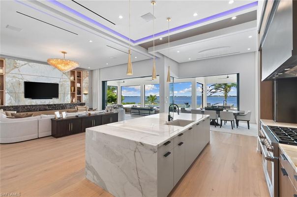 Chandelier, Dining room, Interior, Kitchen, Living room, Pendant Lights, Recessed Lighting, Water, Wood Texture Flooring