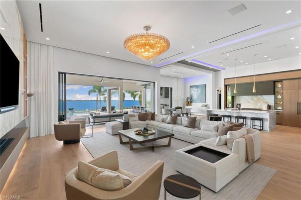 Chandelier, Dining room, Interior, Living room, Marble Walls, Pendant Lights, Recessed Lighting, Water, Wood Texture Flooring