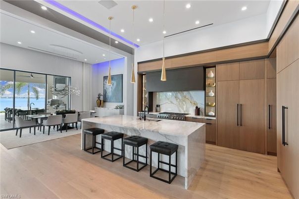 Dining room, Interior, Kitchen, Marble Walls, Pendant Lights, Recessed Lighting, Stainless Steel Appliances, Wood Texture Flooring