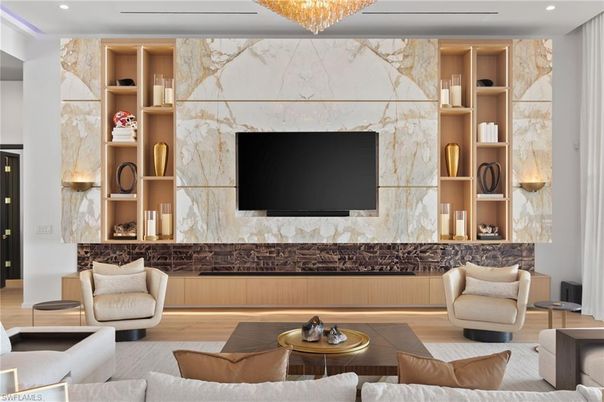 Chandelier, Fireplace, Interior, Living room, Marble Walls, Recessed Lighting, Wood Texture Flooring