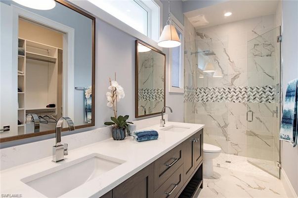 Bathroom, Dual Sink Vanities, Glass Shower, Interior, Marble, Marble Walls, Recessed Lighting