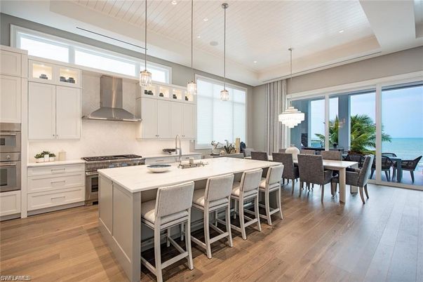 Chandelier, Dining room, Interior, Kitchen, Pendant Lights, Recessed Lighting, Stainless Steel Appliances, Water, Wood Texture Flooring