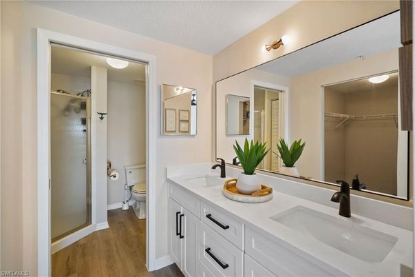 Bathroom, Dual Sink Vanities, Glass Shower, Interior, Walk-in Closets, Wood Texture Flooring