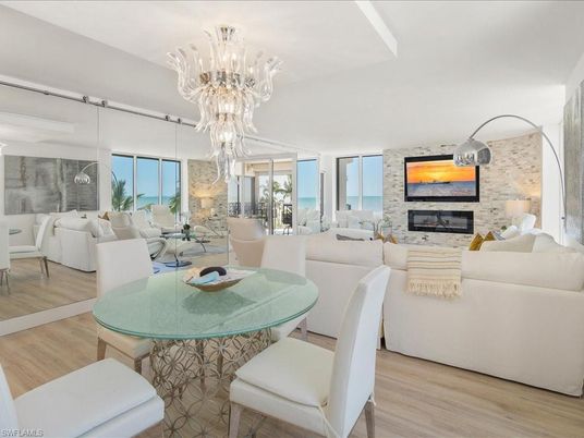 Chandelier, Dining room, Fireplace, Interior, Living room, Pendant Lights, Stone Walls, Wood Texture Flooring