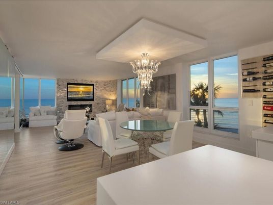 Chandelier, Dining room, Fireplace, Interior, Living room, Stone Walls, Water, Wood Texture Flooring