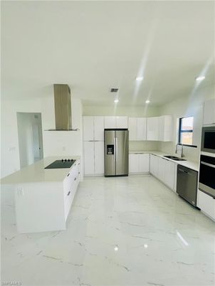 Interior, Kitchen, Marble, Recessed Lighting, Stainless Steel Appliances