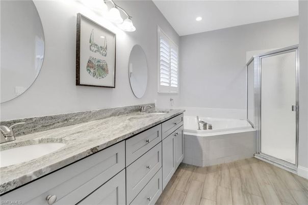 Bathroom, Dual Sink Vanities, Interior, Recessed Lighting, Wood Texture Flooring