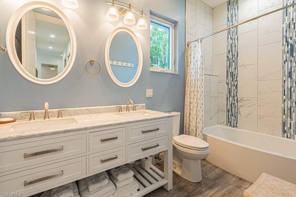 Bathroom, Dual Sink Vanities, Interior, Marble Walls, Wood Texture Flooring