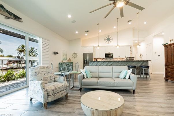 Dining room, Interior, Kitchen, Living room, Pendant Lights, Recessed Lighting, Stainless Steel Appliances, Wood Texture Flooring