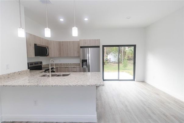 Interior, Kitchen, Pendant Lights, Recessed Lighting, Stainless Steel Appliances, Wood Texture Flooring