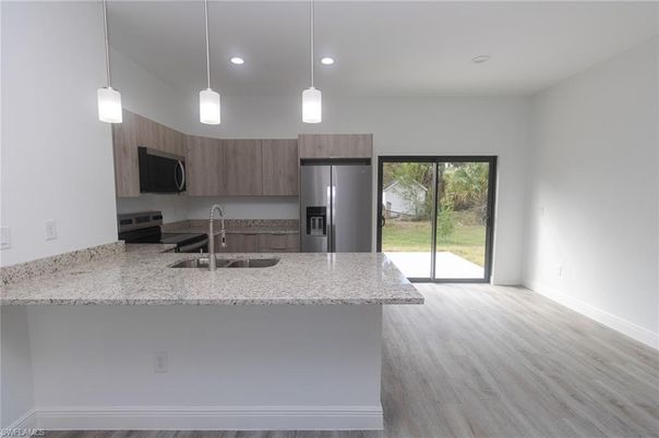 Interior, Kitchen, Pendant Lights, Recessed Lighting, Stainless Steel Appliances, Wood Texture Flooring