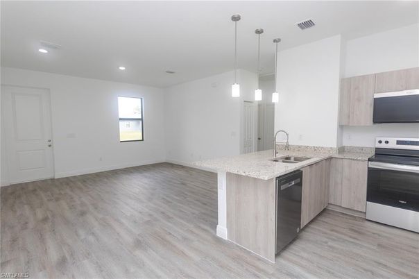 Interior, Kitchen, Pendant Lights, Recessed Lighting, Stainless Steel Appliances, Wood Texture Flooring