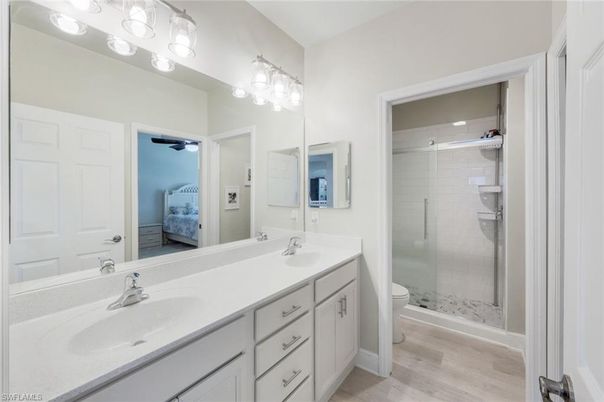 Bathroom, Dual Sink Vanities, Glass Shower, Interior, Wood Texture Flooring